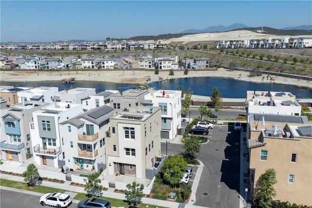 birds eye view of property featuring a water and mountain view