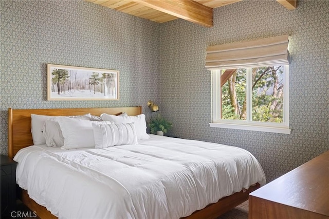 bedroom featuring beam ceiling and wood ceiling