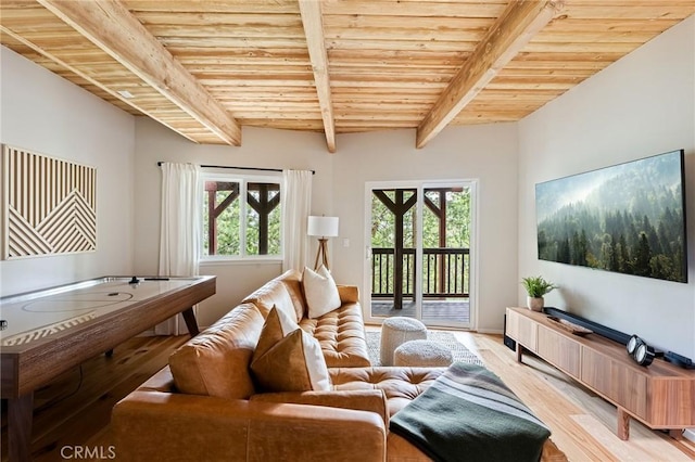 living room with wooden ceiling, a healthy amount of sunlight, light hardwood / wood-style floors, and beamed ceiling