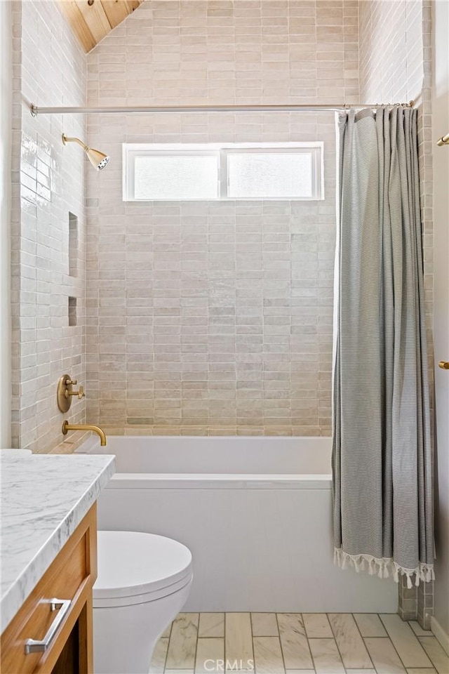 full bathroom featuring shower / bath combo with shower curtain, toilet, and vanity