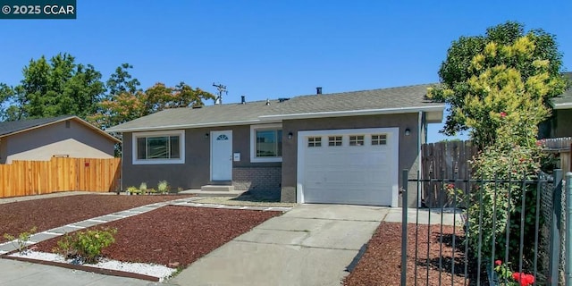 ranch-style home featuring a garage