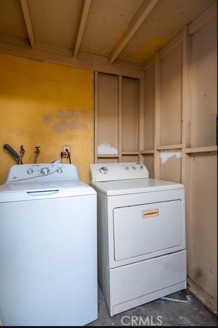 clothes washing area with washer and dryer