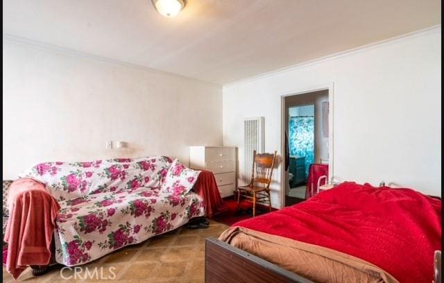 bedroom with carpet floors and crown molding