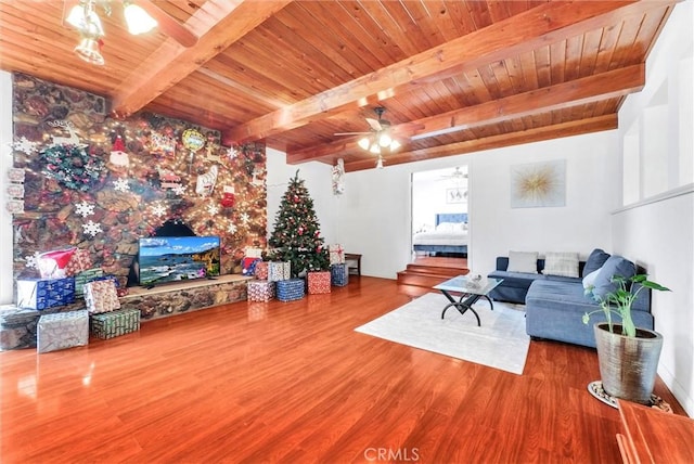 living room with wood ceiling, beamed ceiling, and hardwood / wood-style flooring