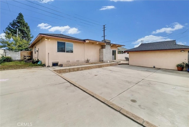 back of property with a patio area