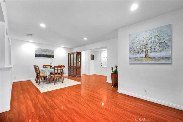 dining area with hardwood / wood-style flooring