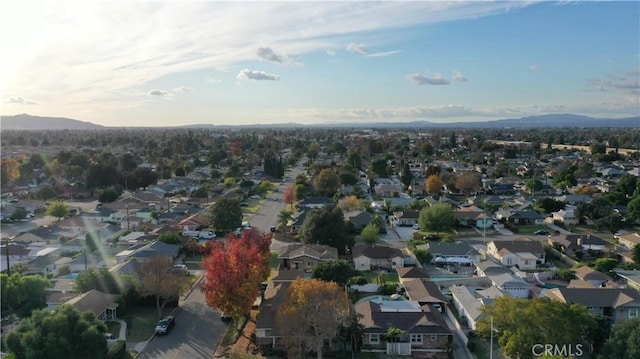 birds eye view of property featuring a mountain view