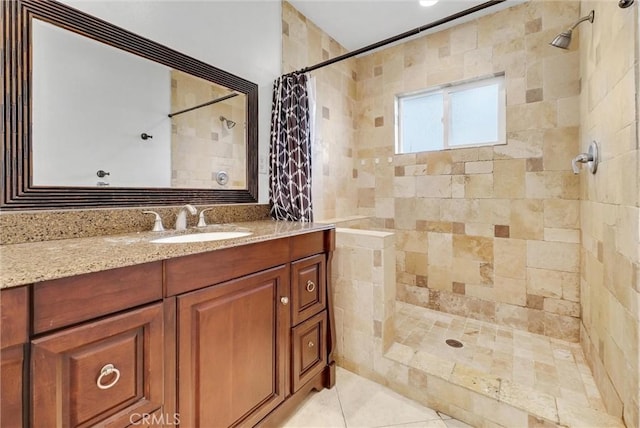 bathroom featuring a shower with shower curtain and vanity