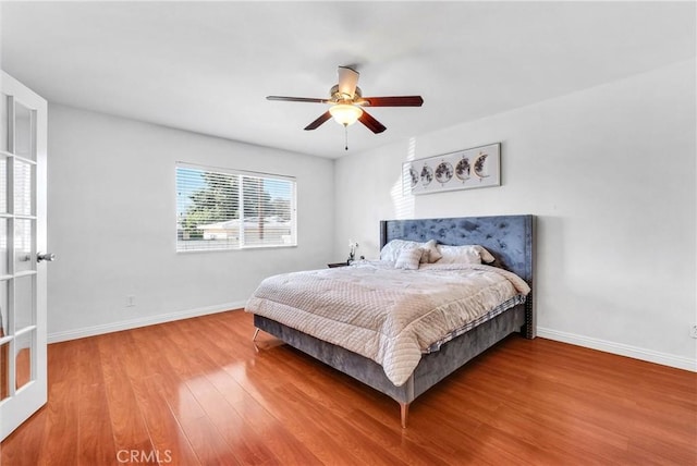 bedroom featuring ceiling fan and wood-type flooring