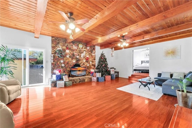 living room with wood ceiling, wood-type flooring, and beamed ceiling