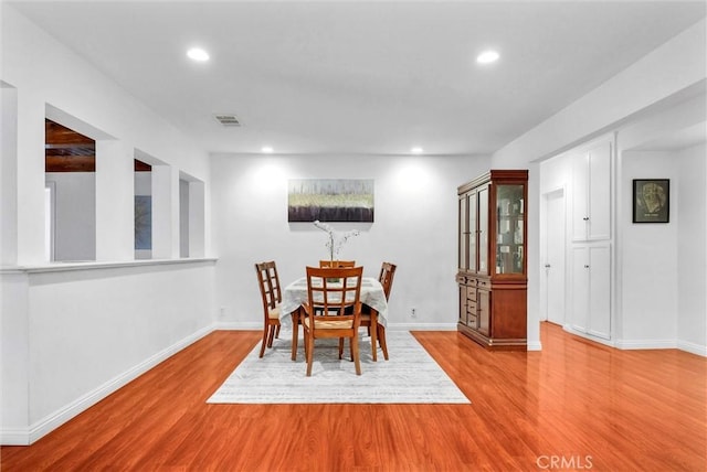 dining room with light hardwood / wood-style floors