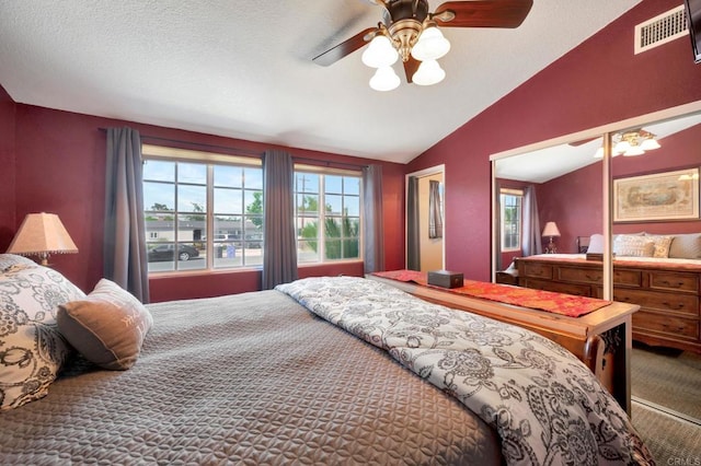 carpeted bedroom featuring ceiling fan and lofted ceiling