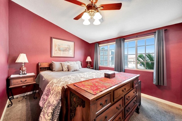 carpeted bedroom featuring ceiling fan and lofted ceiling