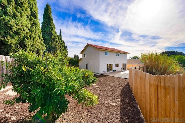 back of property featuring a patio area