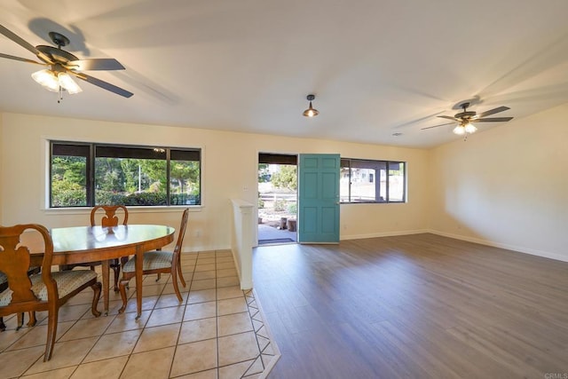 dining area with a wealth of natural light, light hardwood / wood-style floors, and ceiling fan