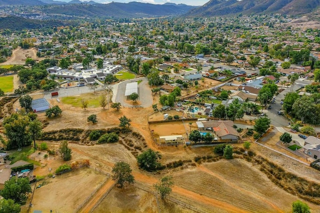 birds eye view of property featuring a mountain view