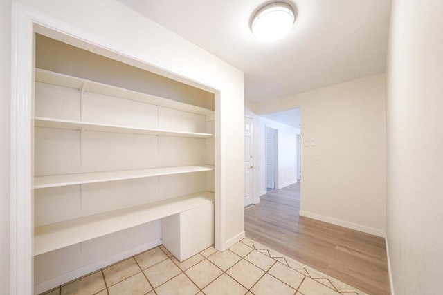 hall with light hardwood / wood-style floors