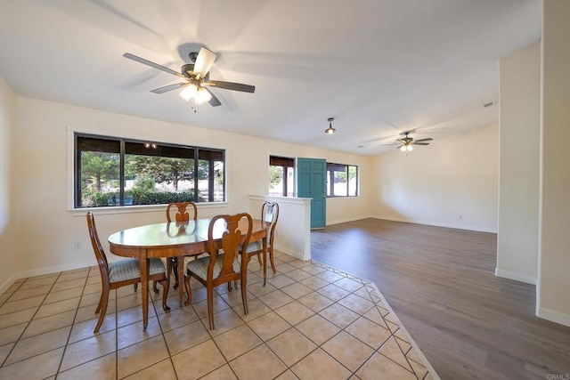 dining room with light hardwood / wood-style flooring and ceiling fan