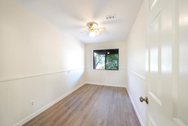 spare room featuring light hardwood / wood-style flooring and ceiling fan