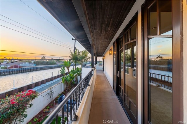 balcony at dusk with a water view