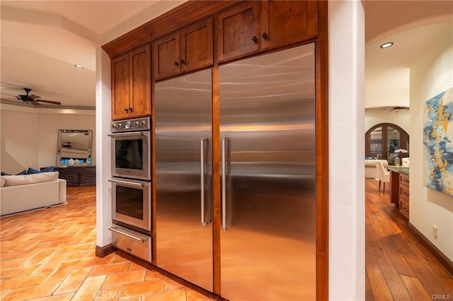 kitchen featuring ceiling fan and appliances with stainless steel finishes