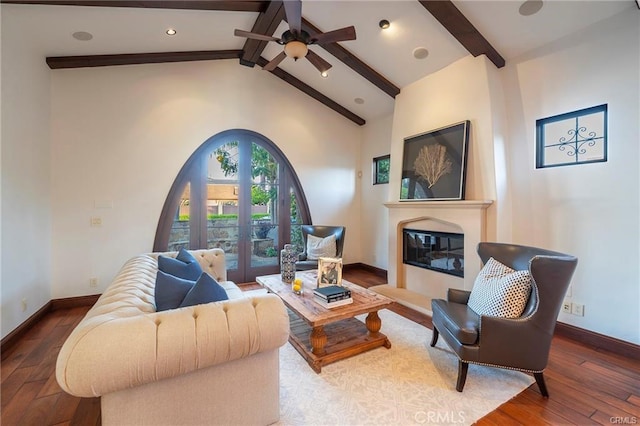 living room with french doors, ceiling fan, wood-type flooring, and lofted ceiling with beams