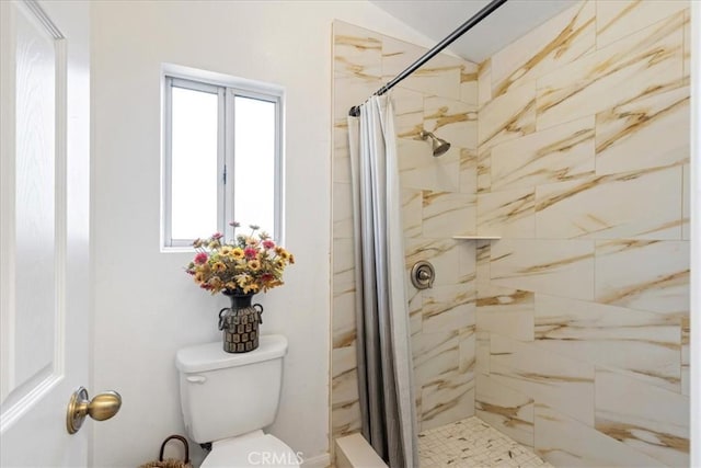 bathroom with toilet and walk in shower