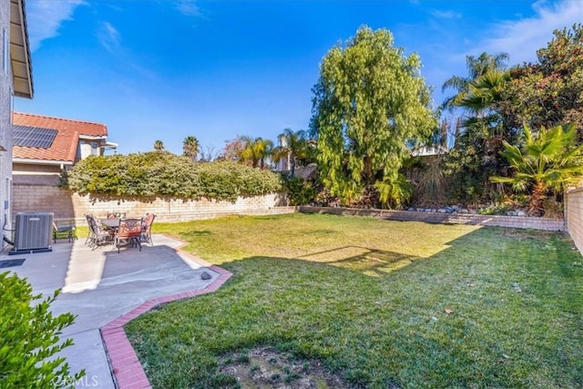 view of yard featuring cooling unit and a patio