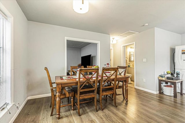 dining area with wood-type flooring