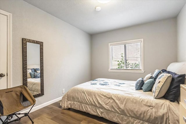 bedroom with hardwood / wood-style floors