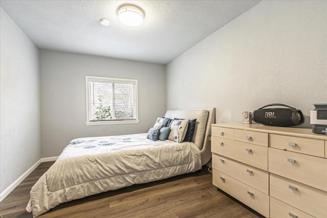 bedroom featuring dark wood-type flooring