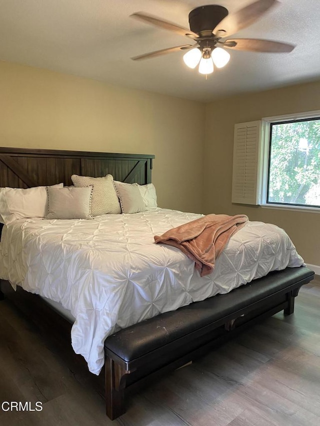 bedroom featuring ceiling fan and wood-type flooring