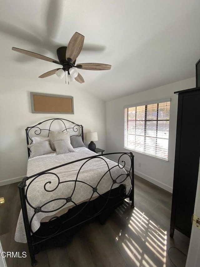 bedroom with dark wood-type flooring and ceiling fan