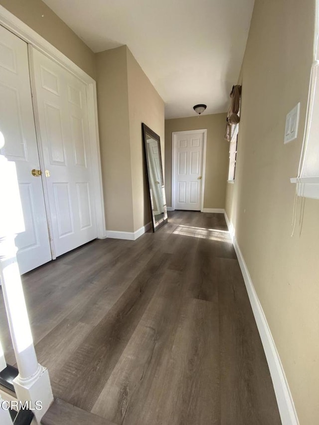 hall with dark hardwood / wood-style floors