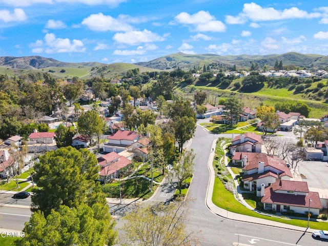 birds eye view of property with a residential view and a mountain view