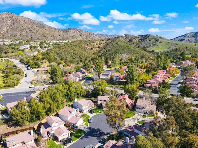 aerial view featuring a mountain view and a residential view