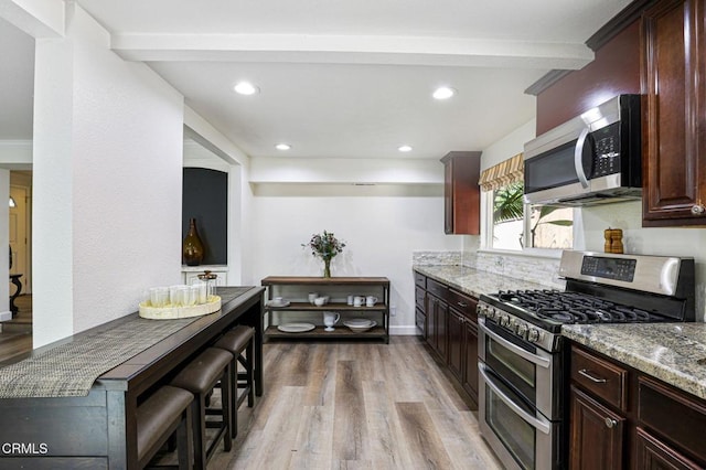 6767 Pheasant Ln, Oak Park, CA 91377 - kitchen featuring appliances with stainless steel finishes, light wood-style flooring, light stone countertops, recessed lighting, and beam ceiling