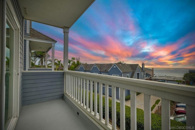 balcony at dusk with a water view