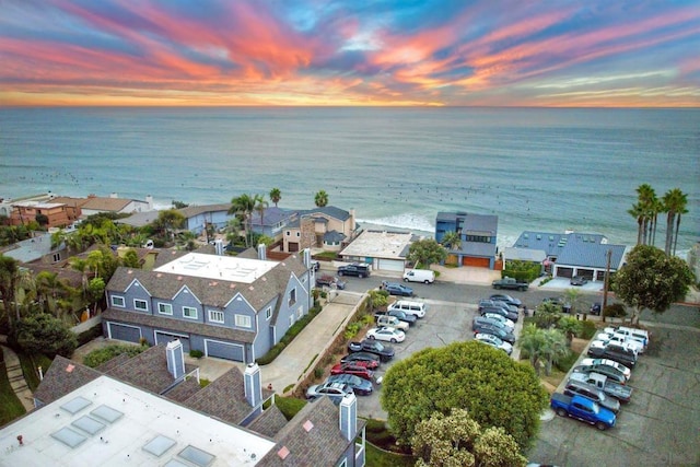 aerial view at dusk with a water view