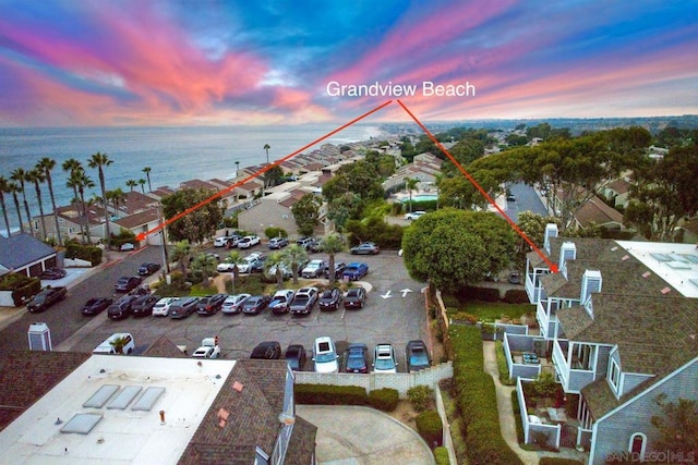 aerial view at dusk with a water view