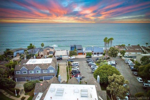 aerial view at dusk with a water view