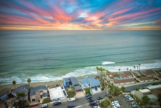 aerial view at dusk with a water view