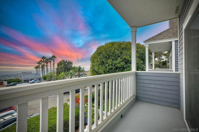 view of balcony at dusk