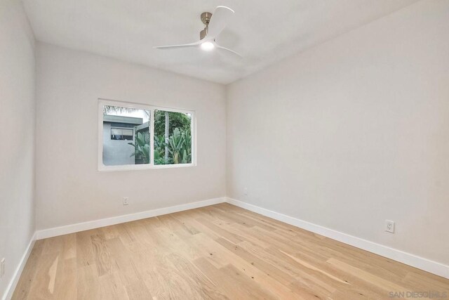 unfurnished room with ceiling fan and light hardwood / wood-style flooring