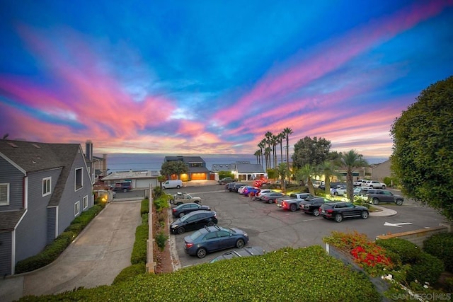 view of parking at dusk