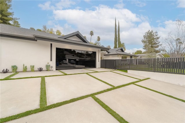 view of patio / terrace with a garage