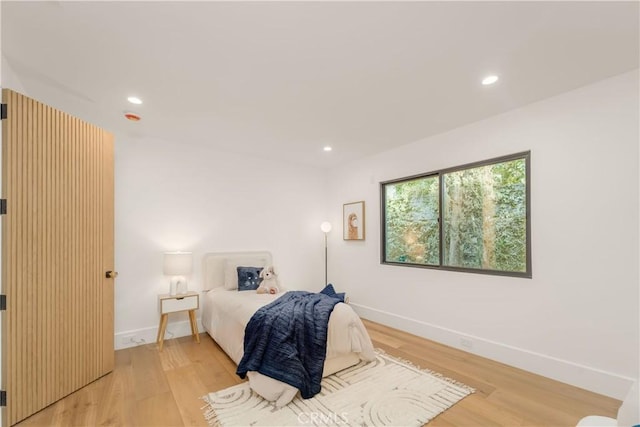 bedroom with light wood-type flooring