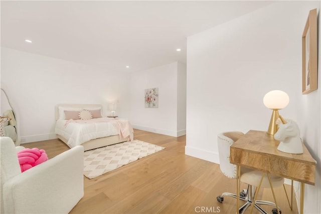 bedroom with hardwood / wood-style flooring