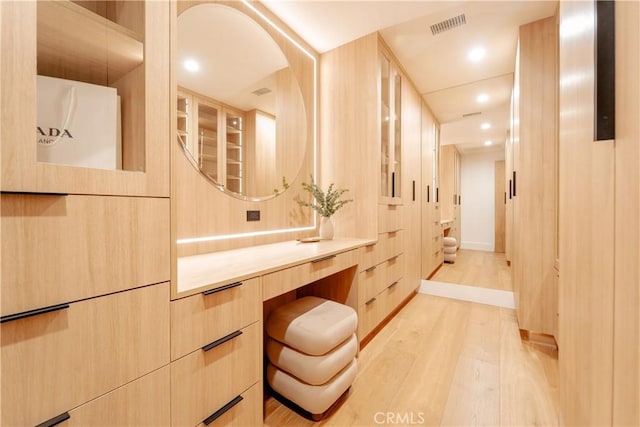 bathroom featuring vanity and hardwood / wood-style flooring