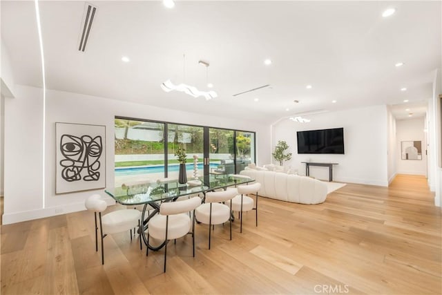 dining area with light hardwood / wood-style floors